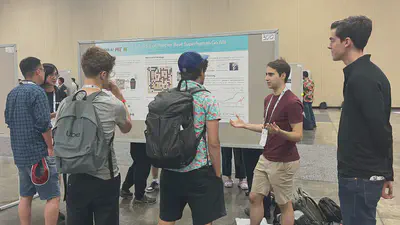 Tony Wang and Adam Gleave presenting our [KataGo attack](https://far.ai/post/2023-07-superhuman-go-ais/) results at ICML 2023